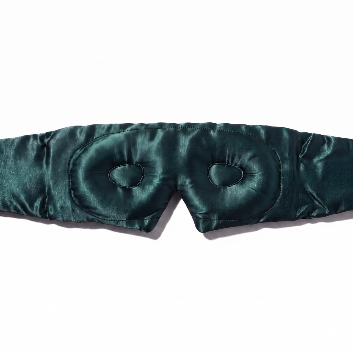 Close-up of the contoured eye cups inside the emerald green RYVENA silk sleep mask