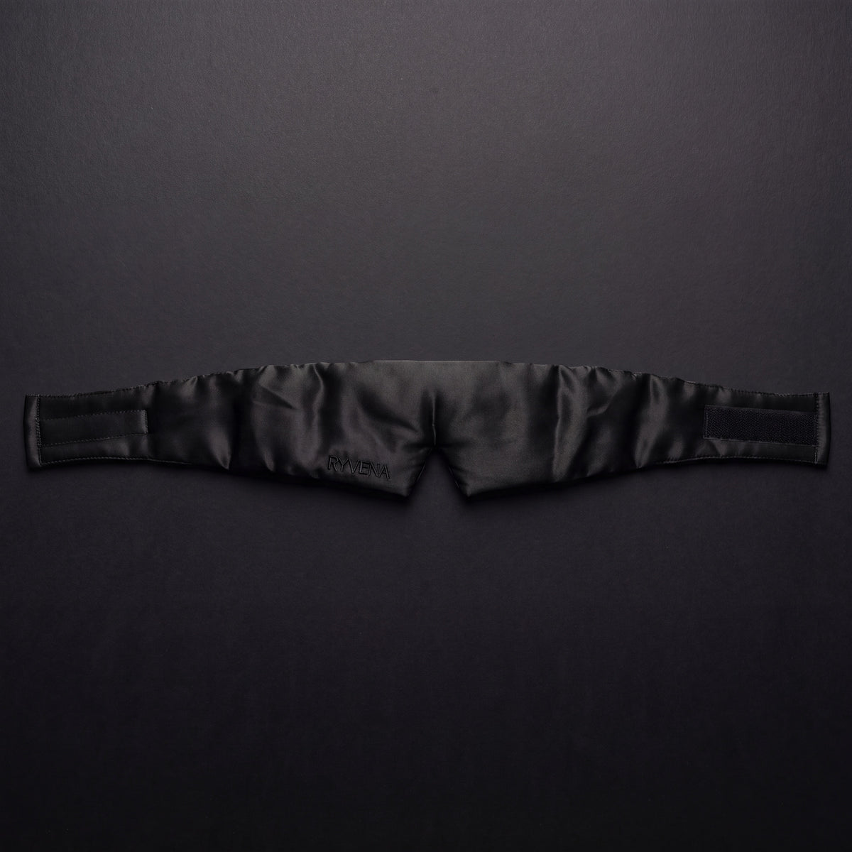 RYVENA deep black silk sleep mask laid flat