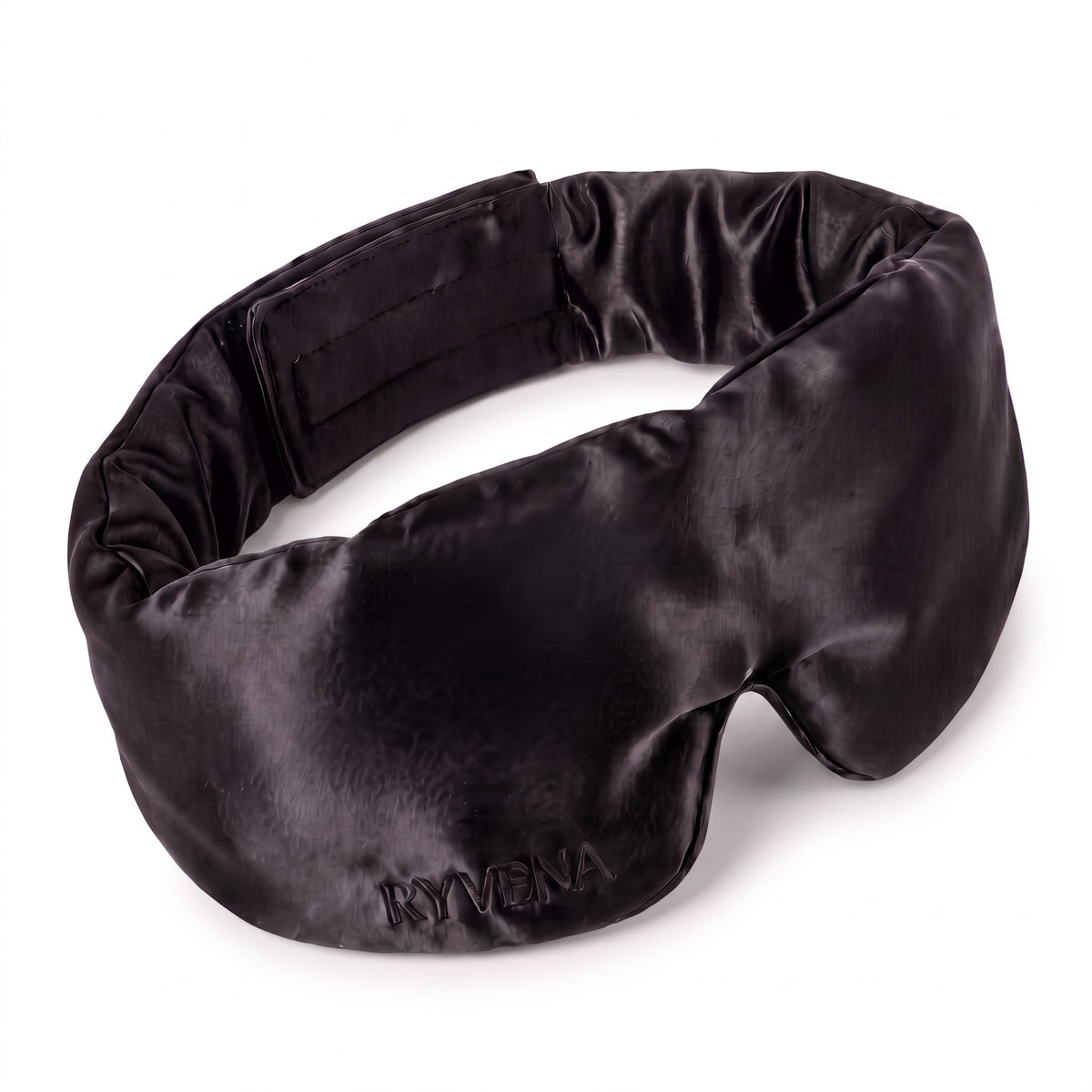 RYVENA contoured silk sleep mask in deep black, angled to show the 22 momme mulberry silk face and tonal embroidery