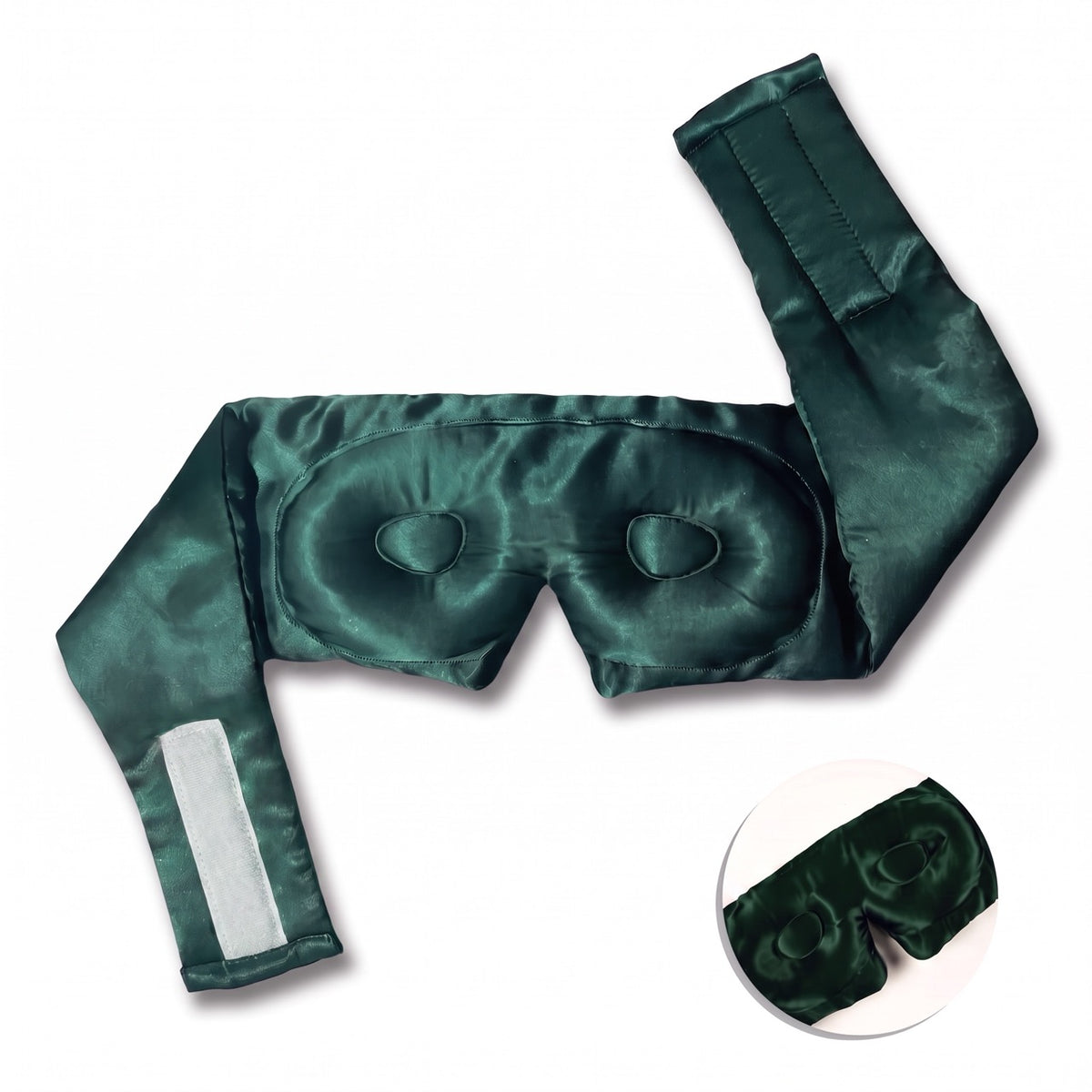Emerald green RYVENA silk sleep mask opened out, showing the full wide silk strap and contoured interior eye cups