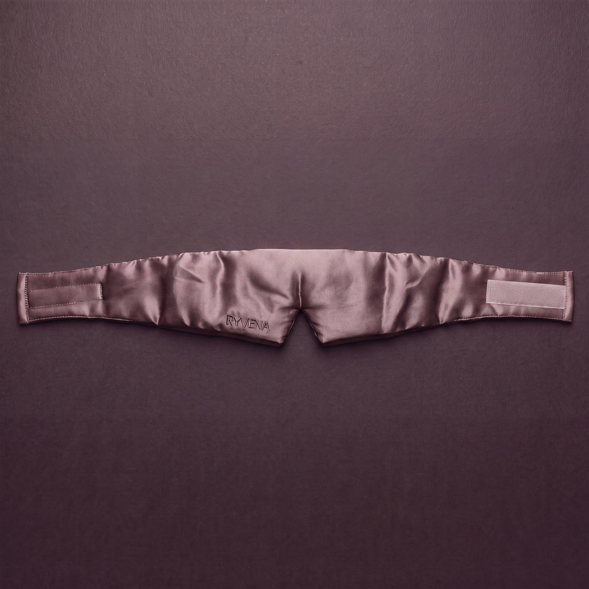 RYVENA blush pink silk sleep mask laid flat