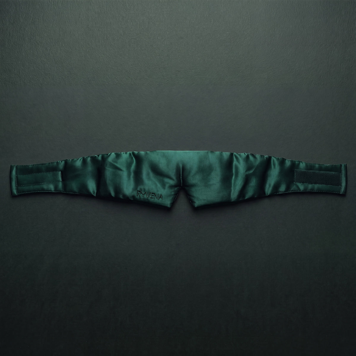 RYVENA emerald green silk sleep mask laid flat