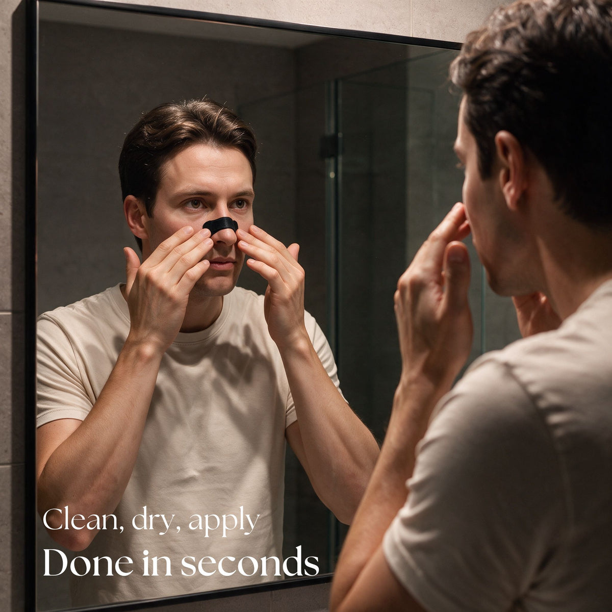 Man applying a RYVENA nose strip in the bathroom