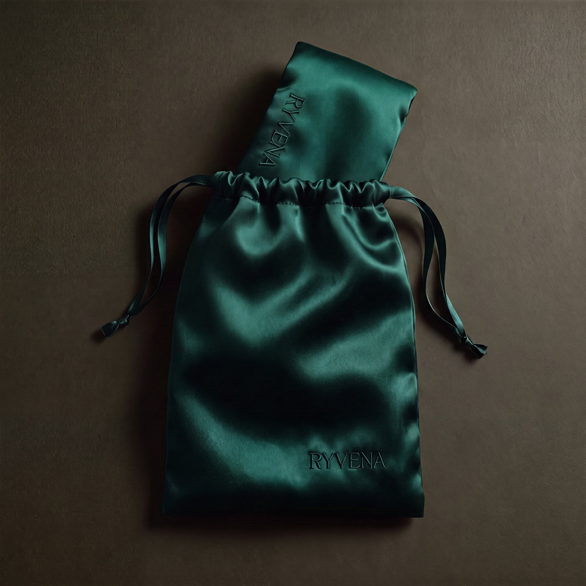 RYVENA emerald green silk sleep mask with its branded carry bag