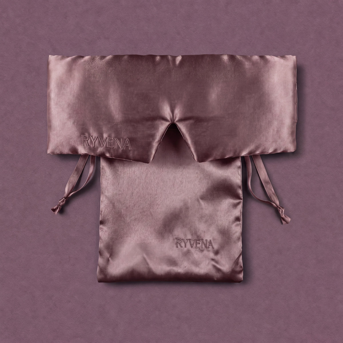 RYVENA blush pink silk sleep mask with its branded carry bag