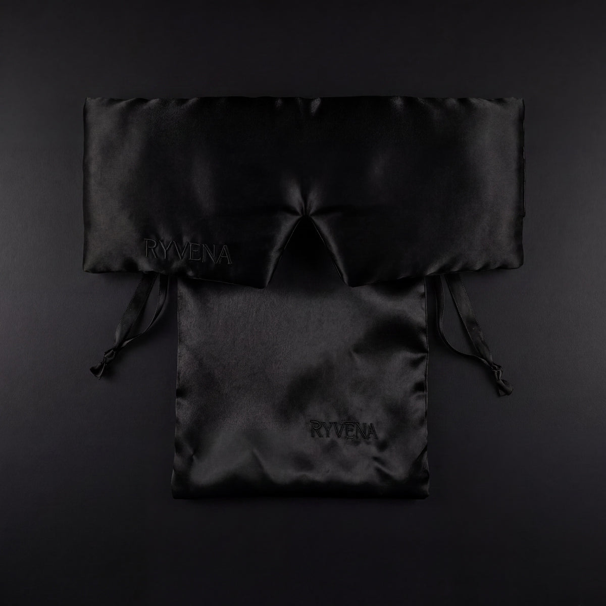 RYVENA deep black silk sleep mask with its branded carry bag