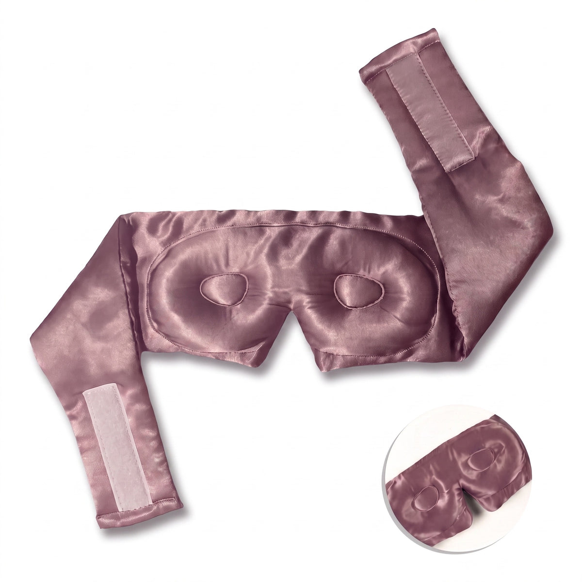 Blush pink RYVENA silk sleep mask opened out, showing the full wide silk strap and contoured interior eye cups