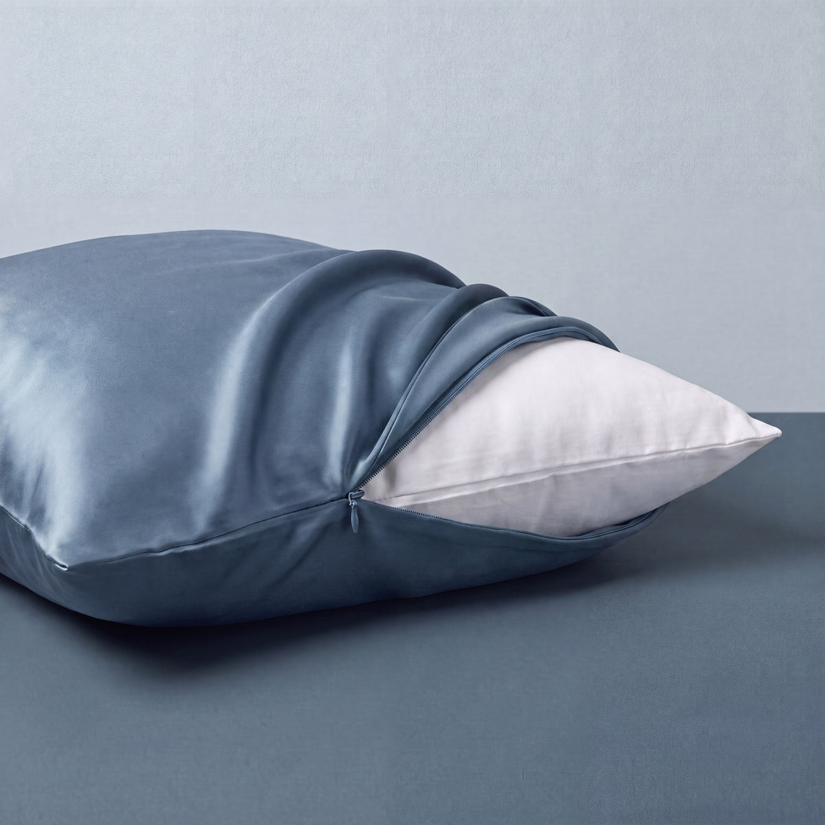 RYVENA steel blue silk pillowcase, closure detail
