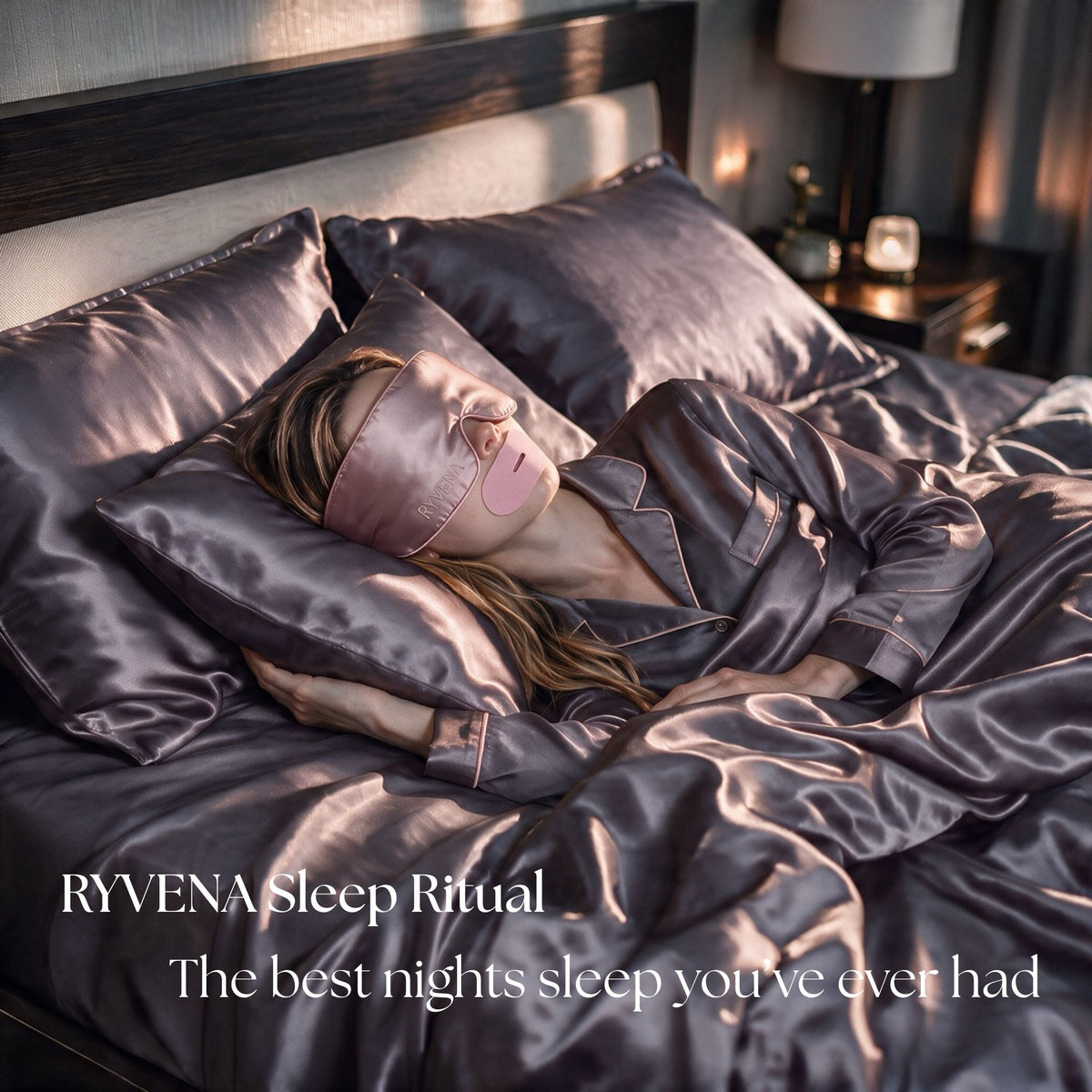 Woman sleeping in a bed wearing RYVENA sleep mask, nose strip and mouth tape on silk bedding and pillowcase.