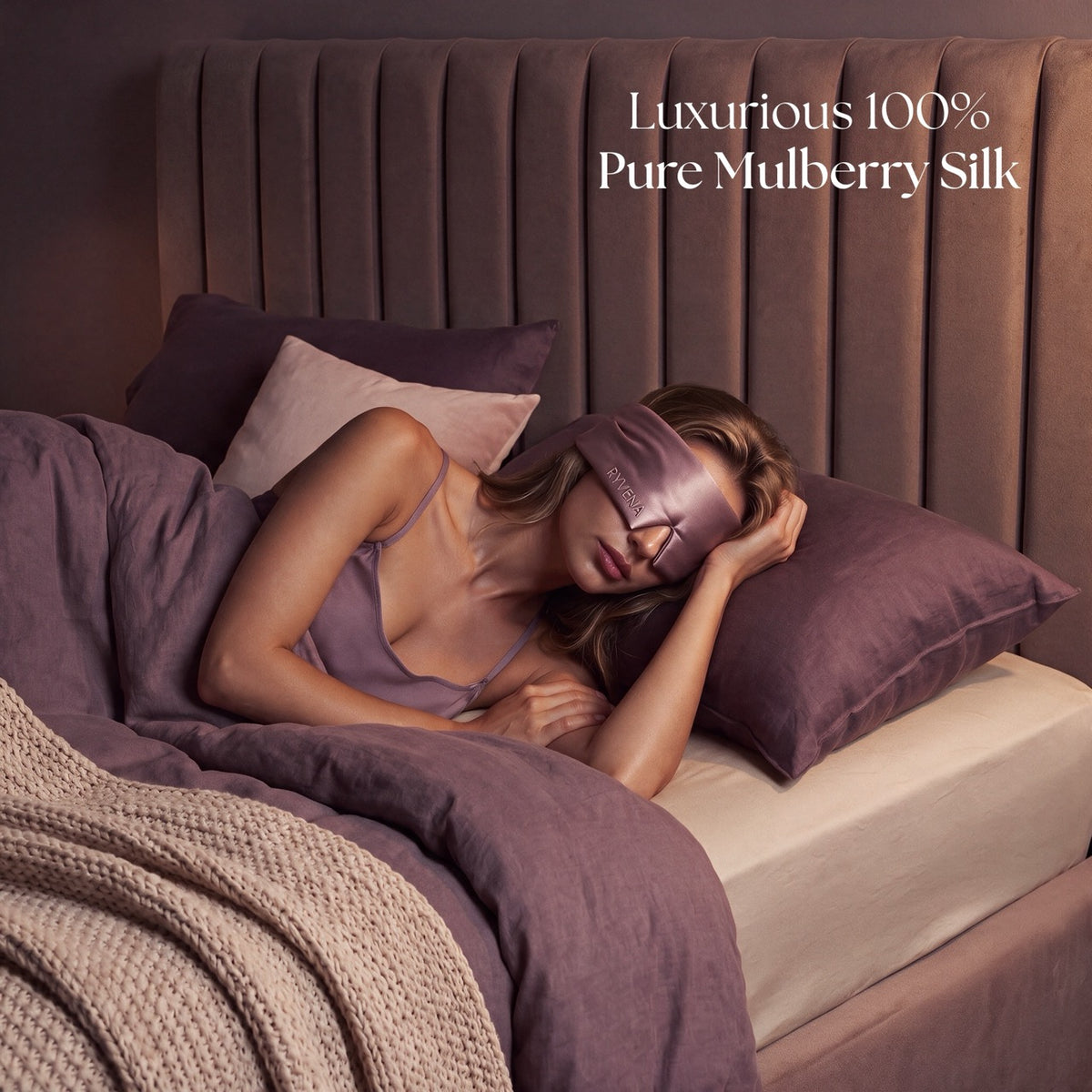 Woman sleeping in the blush pink RYVENA silk sleep mask with no pressure on her eyes or lashes
