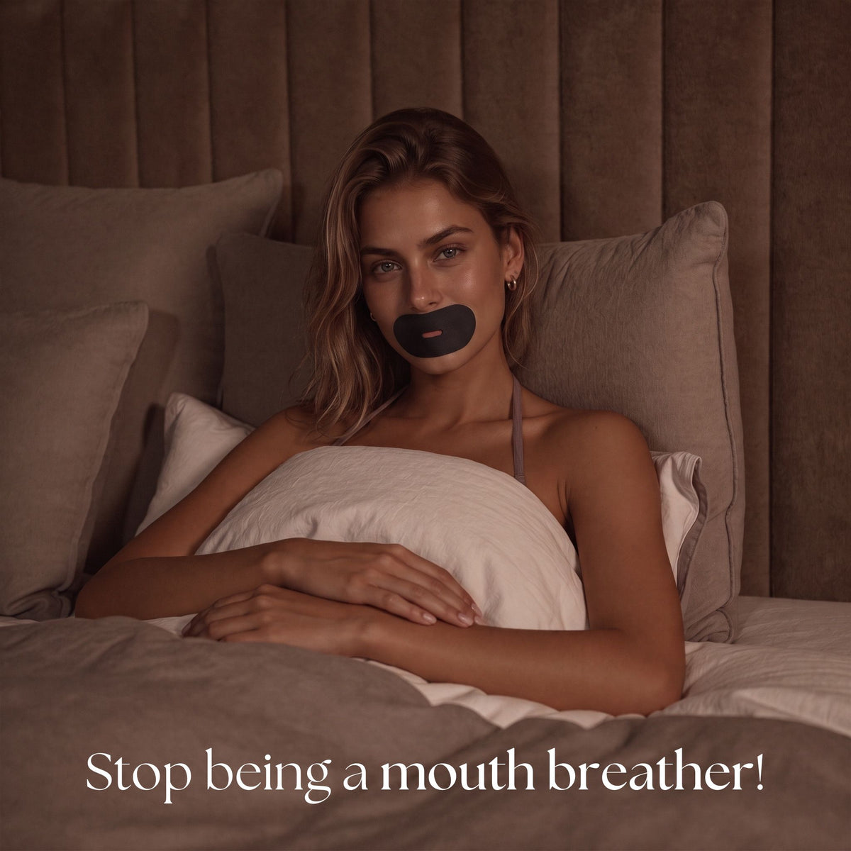 Woman awake in bed wearing black RYVENA mouth tape, captioned stop being a mouth breather