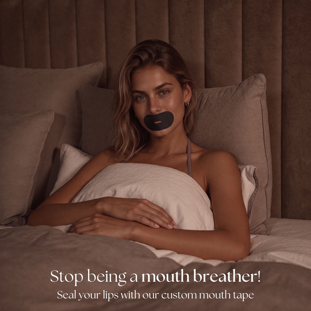 Black RYVENA mouth tape in bed, captioned seal your lips with our custom mouth tape