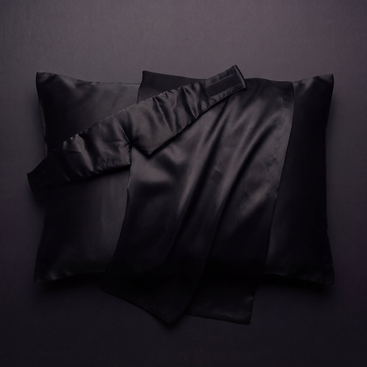 RYVENA silk sleep mask resting on a 22 momme silk pillowcase